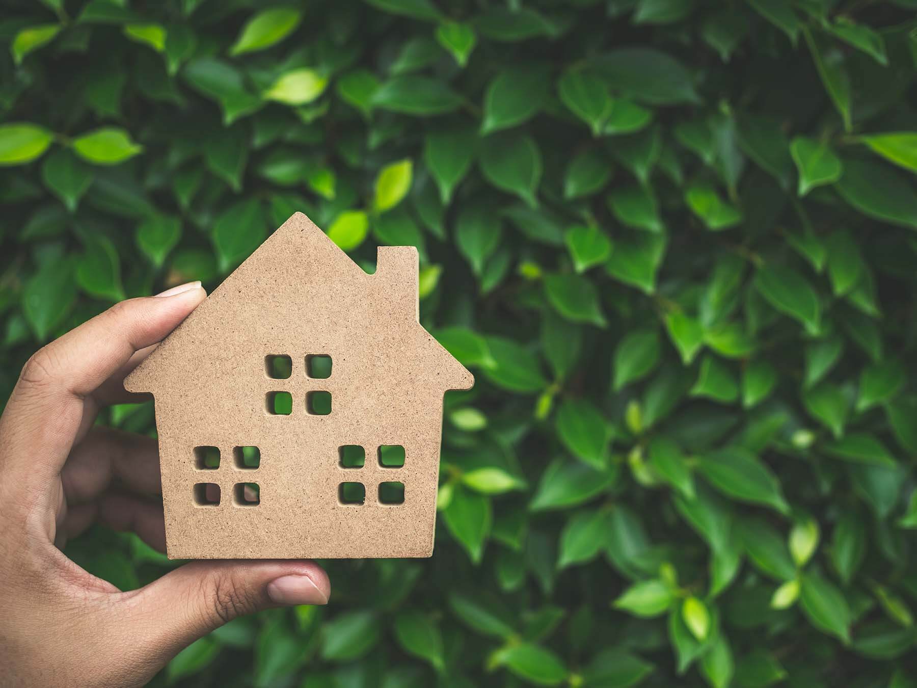 environment cut out wooden house against leafy background